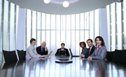 business people sitting at conference table