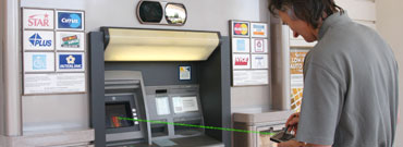 man using quantum key cryptography at an ATM